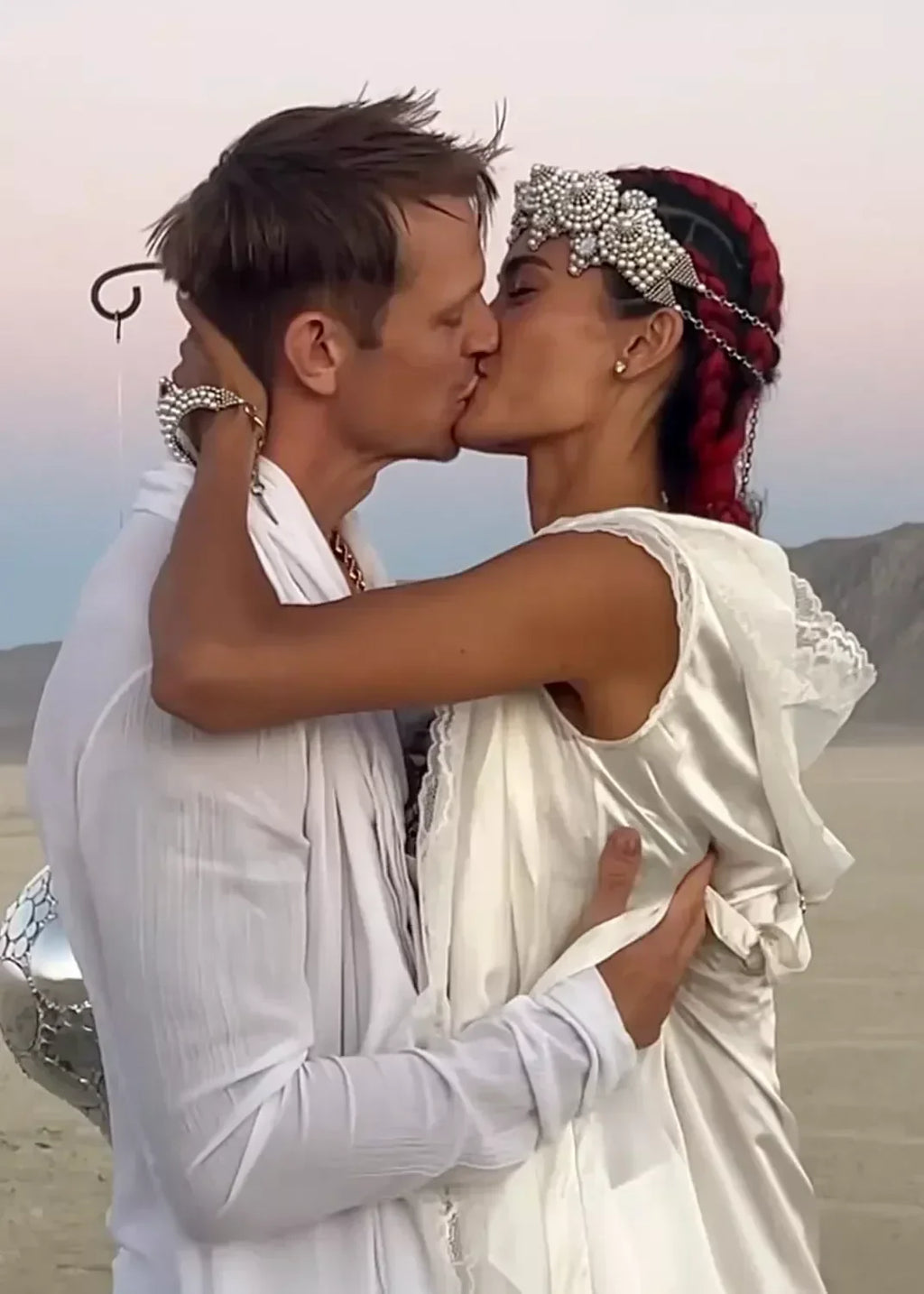 Couple Bridal wear white lace robe with handcrafted Mata Hari Bracelet Ring and Khutulun beaded Top Harness with Pearl Beaded Crown by object and dawn